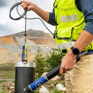 a person testing water in the field