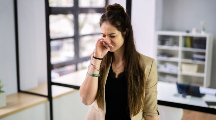 employee sneezing